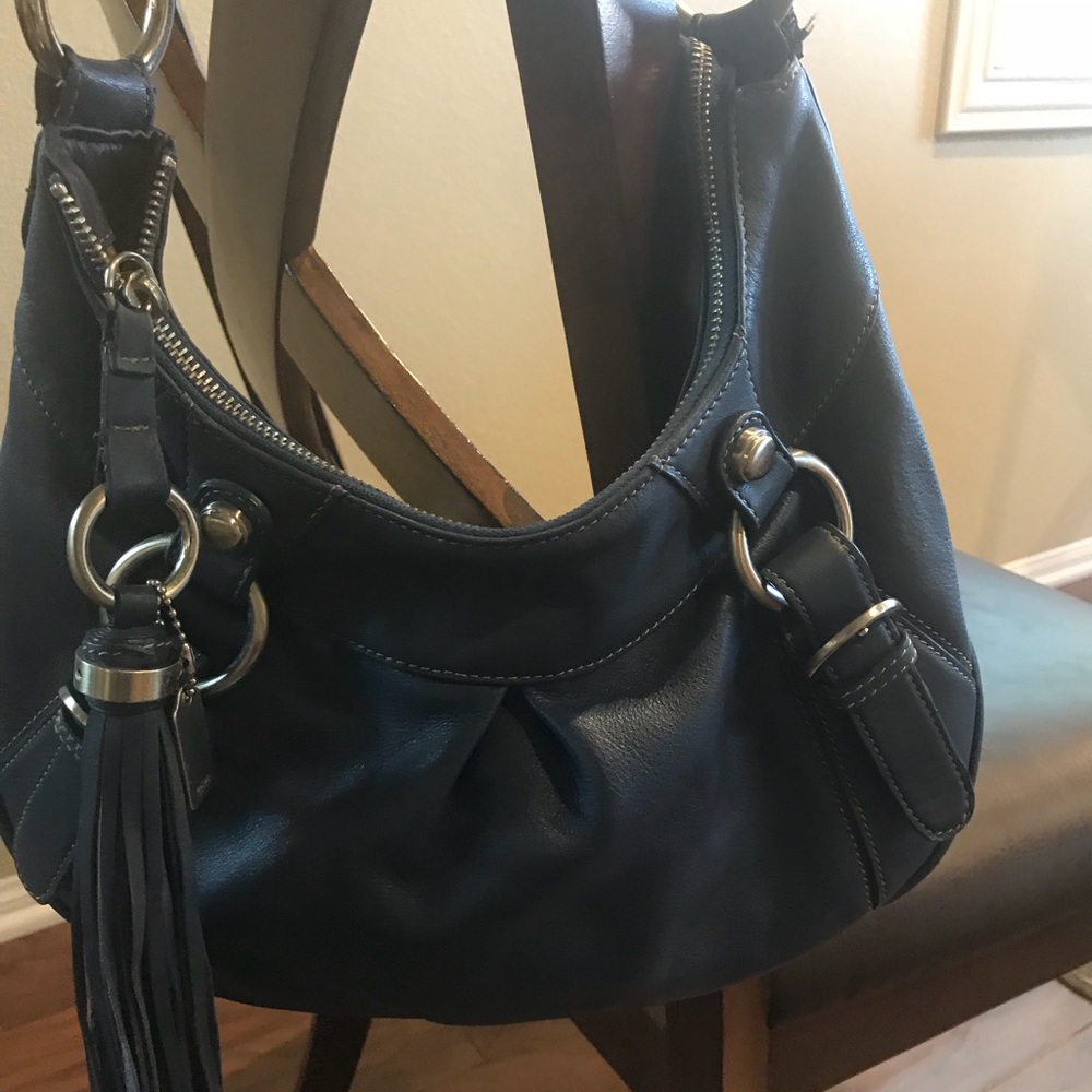Blue leather handbag with tassel